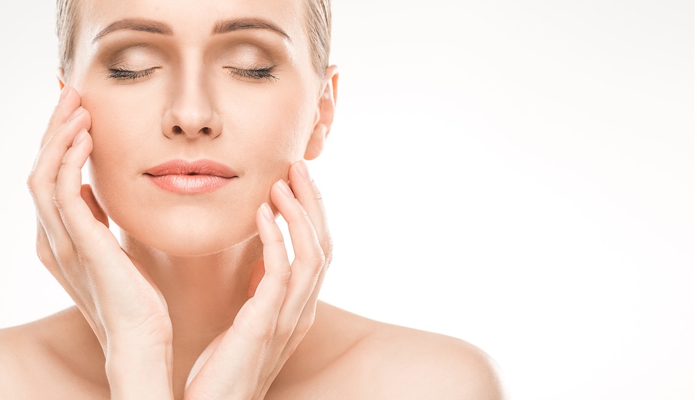 Beautiful woman's face, radiant with smooth skin